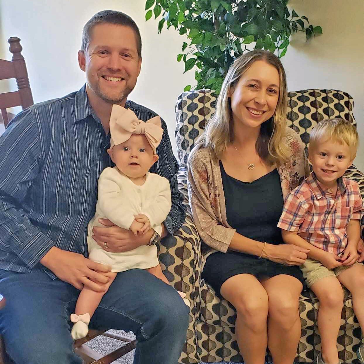 Family photo of Justin, Ashley, Luke, and Emma Colvin