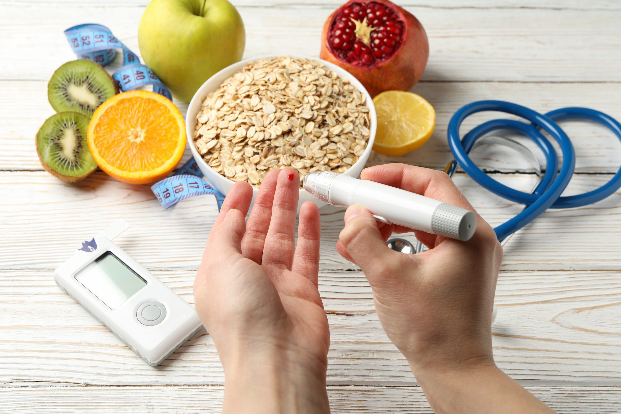Female checking blood sugar level on background with diabetic accessories U.S Congress passes The Inflation Reduction Act of 2022
